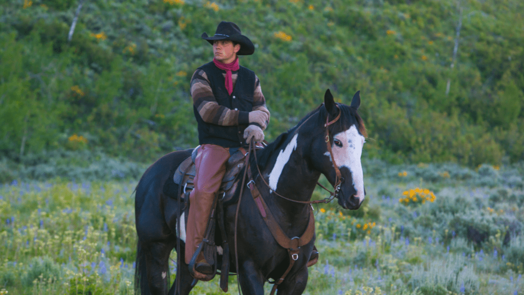 Male Ranch Hand Riding a Horse