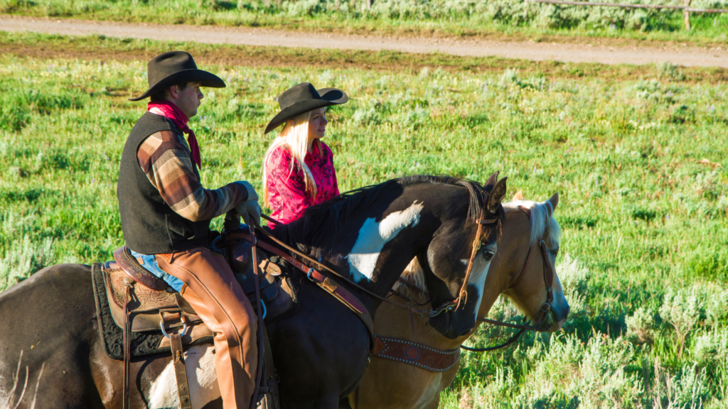 Male and Female Ranch Hand Riding Horse