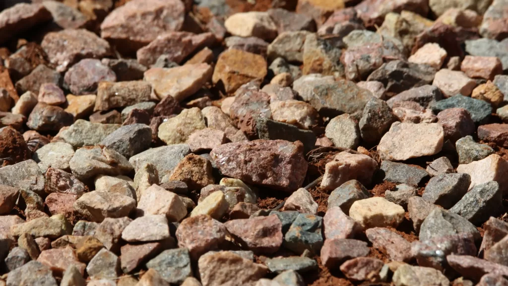 Close-up view of crushed stone used in construction aggregate for roads, driveways, and concrete production