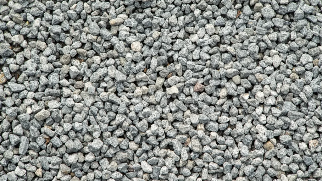 Gravel aggregate, essential for drainage systems, landscaping, and concrete production in construction projects