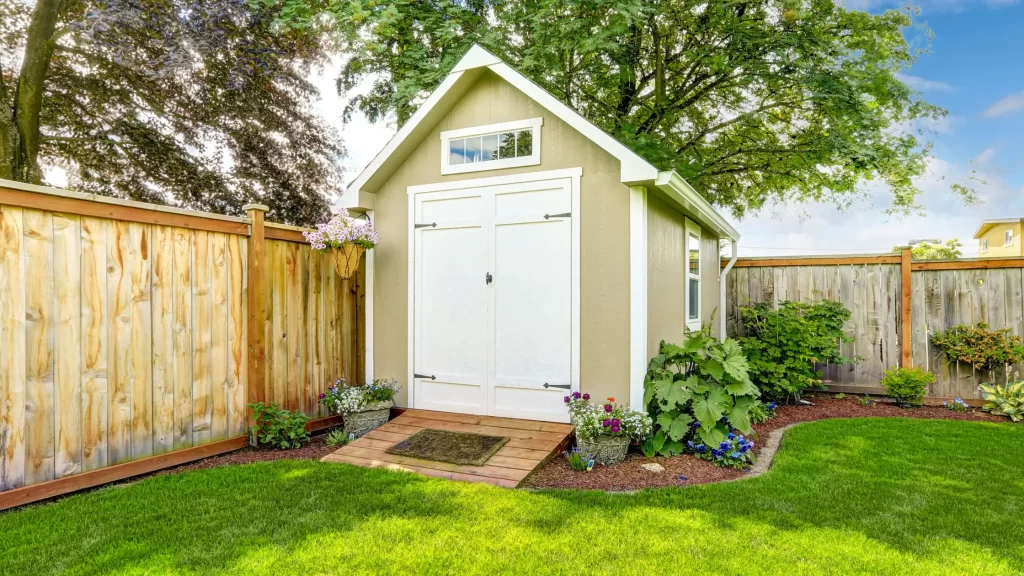Fenced Backyard with Small Shed - Regular maintenance ensures long-term shed protection