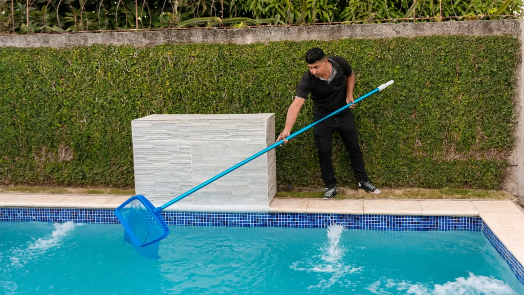 Pool Personnel Cleaning the Pool
