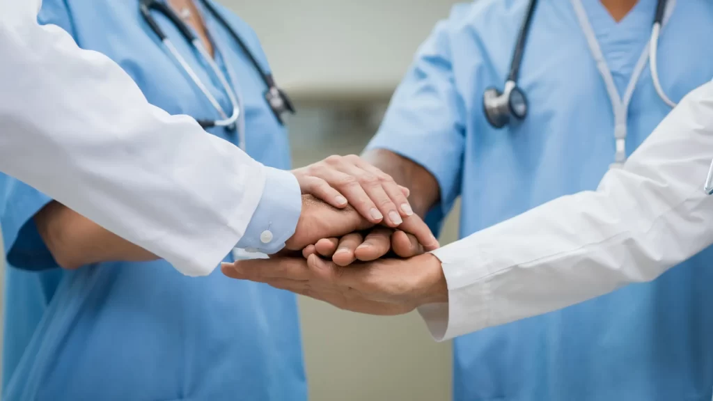 Nurse Practitioners Team Hands Together