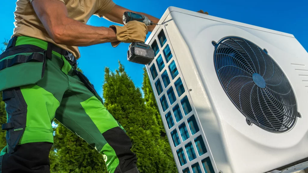 HVAC technician installing large modern heat pump - showcasing ways to increase tech earnings