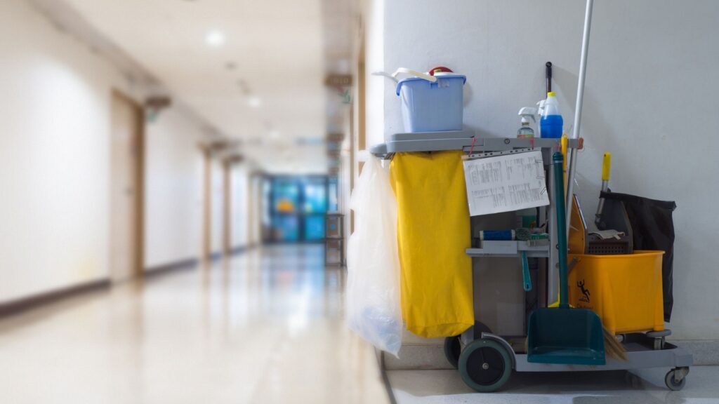 Cleaning cart in a hallway representing the hardworking janitors honored on National Janitor Day for maintaining clean and hygienic environments