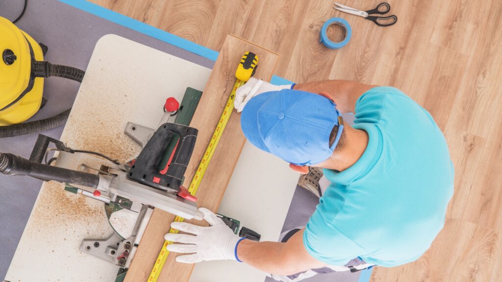 Flooring Contractor at Work symbolizing How to Price Flooring Jobs