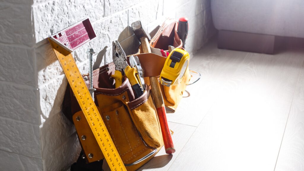 Carpenter tool belt with various tools like hammer, measuring tape, and pliers for efficient tool organization