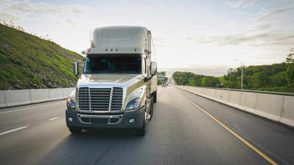 Truck driving on the highway under federal regulations on how many hours a truck driver can drive