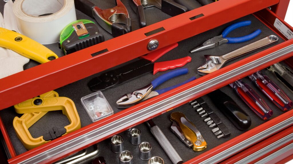 Well-organized handyman toolbox with various tools, demonstrating effective handyman tool list organization