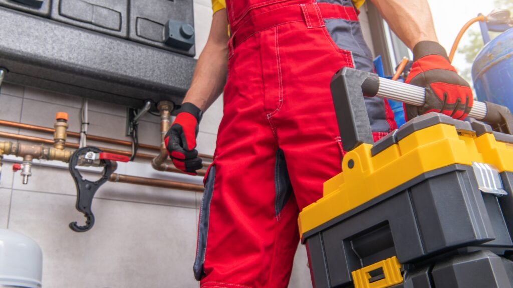 HVAC technician carrying a well-organized toolbox, essential for efficient work as listed in HVAC technician tool list