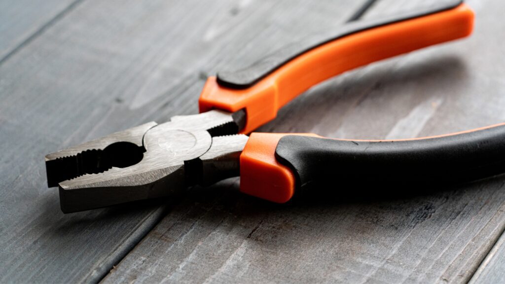 Needle-nose pliers from an electrician tools list, essential for gripping and cutting wires