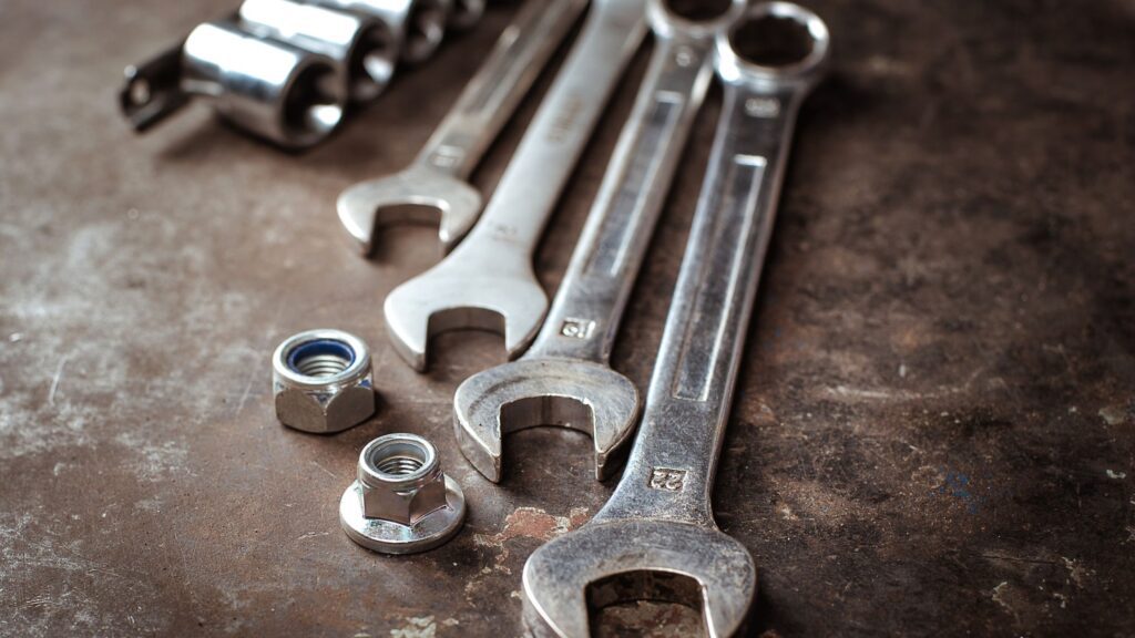 Set of wrenches and nuts, illustrating when to repair or replace tools in how to maintain tools guide